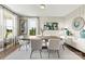 Modern dining room featuring hardwood floors and large windows at 312 Coronado Ave # 41, Matthews, NC 28104