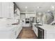 Modern kitchen with stainless steel appliances and white cabinetry at 312 Coronado Ave # 41, Matthews, NC 28104