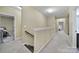 Upstairs hallway with carpet, neutral paint, and access to all the bedrooms at 3155 Pinehills Way, Mount Holly, NC 28120