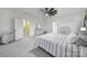 Bright main bedroom with white walls, featuring a bed, dresser, and closet access at 3155 Pinehills Way, Mount Holly, NC 28120