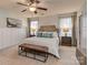 Spacious bedroom with large bed, nightstands, and ceiling fan at 3203 Morgan Clark Rd, Charlotte, NC 28208