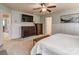 Main bedroom with large TV, dresser, and en-suite bathroom at 3203 Morgan Clark Rd, Charlotte, NC 28208