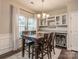 Bright dining area with a built-in wine cooler and four-chair wooden table at 3203 Morgan Clark Rd, Charlotte, NC 28208