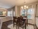 Dining area with dark wood table and chairs, near kitchen and living room at 3203 Morgan Clark Rd, Charlotte, NC 28208