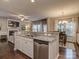 Open kitchen with granite island, stainless steel dishwasher, and seating at 3203 Morgan Clark Rd, Charlotte, NC 28208