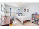 Well-lit bedroom with a double closet, desk, and bookshelf at 3322 Yarmouth Ln, Gastonia, NC 28056