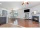 Dining area with hardwood floors, white table and chairs, and modern light fixture at 3322 Yarmouth Ln, Gastonia, NC 28056