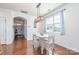 Light and airy dining room with hardwood floors, white table and chairs at 3322 Yarmouth Ln, Gastonia, NC 28056