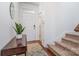 Bright and airy entryway with hardwood floors, staircase, and a charming console table at 3322 Yarmouth Ln, Gastonia, NC 28056