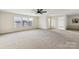 Spacious bedroom with ceiling fan and neutral carpeting at 3366 Table Rock Dr, Gastonia, NC 28052