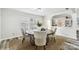 Charming dining room with round wooden table and six light-grey chairs at 3366 Table Rock Dr, Gastonia, NC 28052