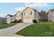 Exterior of a two-story house with a driveway and a neatly landscaped lawn at 3366 Table Rock Dr, Gastonia, NC 28052