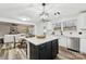 Modern kitchen with white cabinets and a large kitchen island at 3366 Table Rock Dr, Gastonia, NC 28052