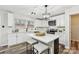 Modern kitchen with white cabinets, quartz countertops, and a kitchen island at 3366 Table Rock Dr, Gastonia, NC 28052