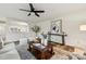 Living room with hardwood floors, large windows, and comfortable seating arrangement at 3366 Table Rock Dr, Gastonia, NC 28052