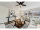 Living room with hardwood floors, neutral decor, and a cozy seating area with a large window at 3366 Table Rock Dr, Gastonia, NC 28052