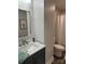 Modern bathroom with dark vanity and marble countertop at 407 E Talleyrand Ave, Monroe, NC 28112