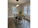 Bright dining area with four chairs and large windows at 407 E Talleyrand Ave, Monroe, NC 28112