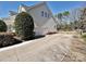 Long driveway leading to a two-car garage, complemented by established landscaping and a classic fence at 4407 Esherwood Ln, Charlotte, NC 28270