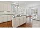 Well-lit kitchen featuring granite countertops, a central island, and stainless steel appliances at 4407 Esherwood Ln, Charlotte, NC 28270