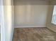 Empty carpeted bedroom with window and neutral walls at 4529 Esmeralda Dr, Charlotte, NC 28269