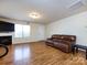 Living room featuring hardwood floors and a fireplace at 4529 Esmeralda Dr, Charlotte, NC 28269