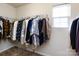 Walk-in closet with clothes hanging on racks at 4529 Esmeralda Dr, Charlotte, NC 28269