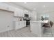 Modern kitchen with white cabinets, island, and stainless steel appliances at 478 Berryman Rd, Rock Hill, SC 29732