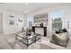 Living room with a glass coffee table and neutral colored couch at 478 Berryman Rd, Rock Hill, SC 29732