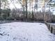 Snowy backyard with wooden fence at 48374 Pfeiffer Pl, Misenheimer, NC 28109