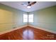 Bedroom with hardwood floors and corner windows at 48374 Pfeiffer Pl, Misenheimer, NC 28109