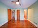 Bedroom with hardwood floors and access to other rooms at 48374 Pfeiffer Pl, Misenheimer, NC 28109