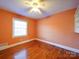 Bedroom with hardwood floors and built-in shelves at 48374 Pfeiffer Pl, Misenheimer, NC 28109