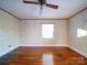 Bedroom with hardwood floors, ceiling fan, and window at 48374 Pfeiffer Pl, Misenheimer, NC 28109