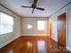 Bright bedroom with hardwood floors and ceiling fan at 48374 Pfeiffer Pl, Misenheimer, NC 28109