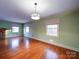 Dining room with hardwood floors and access to kitchen at 48374 Pfeiffer Pl, Misenheimer, NC 28109