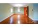 Bright dining room with hardwood floors and a light green color scheme at 48374 Pfeiffer Pl, Misenheimer, NC 28109