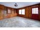 Dining room with wood paneling, tile floor, and built-in shelving at 48374 Pfeiffer Pl, Misenheimer, NC 28109