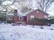 Brick ranch home with snow-covered yard at 48374 Pfeiffer Pl, Misenheimer, NC 28109