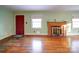 Living room with hardwood floors, fireplace and red door at 48374 Pfeiffer Pl, Misenheimer, NC 28109