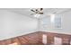 Spacious bedroom with wood floors and two large windows at 507 Bearbrook Ln, Gastonia, NC 28052