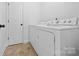 Convenient laundry room with washer, dryer, and extra storage at 507 Bearbrook Ln, Gastonia, NC 28052