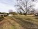 Large backyard with mature trees and plenty of open space at 509 Baucom Deese Rd, Monroe, NC 28110