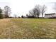 This large, flat, grassy backyard, with trees, is ideal for play, pets, and outdoor living at 509 Baucom Deese Rd, Monroe, NC 28110