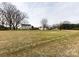 Large backyard with mature trees and shed at 509 Baucom Deese Rd, Monroe, NC 28110