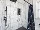 Shower room featuring white subway tile, black fixtures, and a rainfall showerhead at 509 Baucom Deese Rd, Monroe, NC 28110