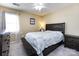 Cozy bedroom with a full bed, dark wood dresser and a ceiling fan at 509 Baucom Deese Rd, Monroe, NC 28110