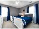 Bedroom with two beds, blue blankets, and white furnishings at 509 Baucom Deese Rd, Monroe, NC 28110