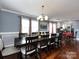 Spacious dining room with a long table, offering ample seating and views into the kitchen at 509 Baucom Deese Rd, Monroe, NC 28110