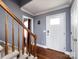 Bright entryway with hardwood floors, staircase, and white door at 509 Baucom Deese Rd, Monroe, NC 28110